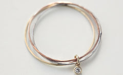 THREE WHISPERS DIAMOND RING