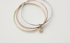 THREE WHISPERS DIAMOND RING