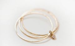 YELLOW GOLD THREE WHISPERS DIAMOND RING